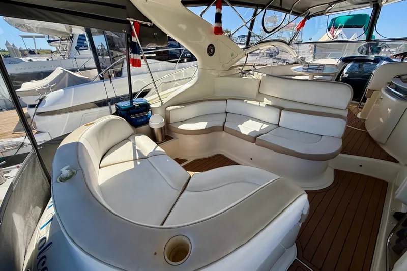 Slide: The Image of Luxurious 2006 Azimut Atlantis 47 yacht interior with elegant seating and wooden flooring. - 8