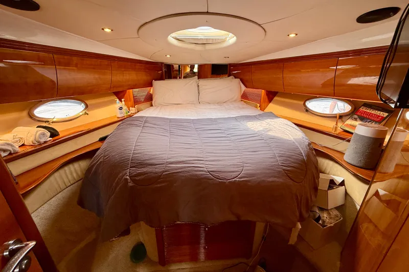 Slide: The Image of Luxurious cabin interior of 2006 Azimut Atlantis 47 yacht with cozy bed and wooden finish. - 25