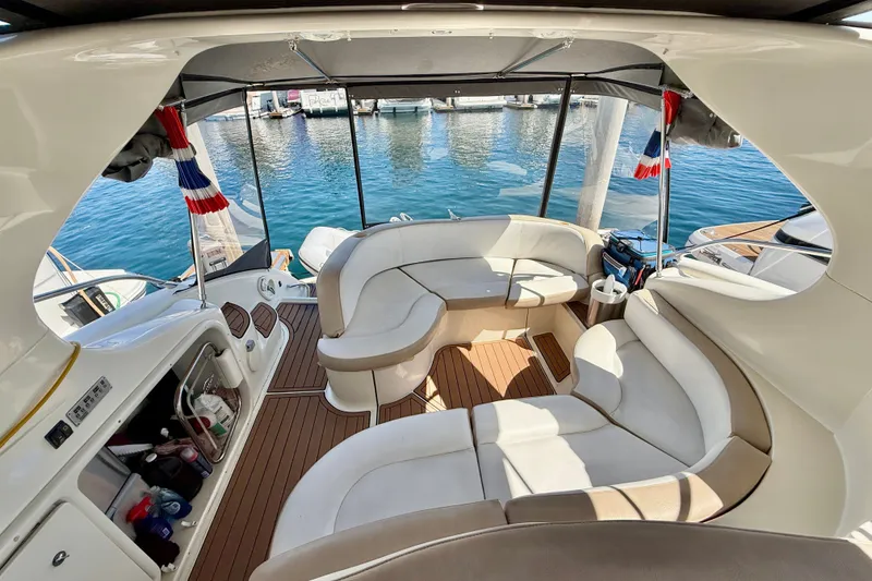 Slide: The Image of Luxurious interior of a 2006 Azimut Atlantis 47 yacht with elegant seating and scenic marina view. - 9
