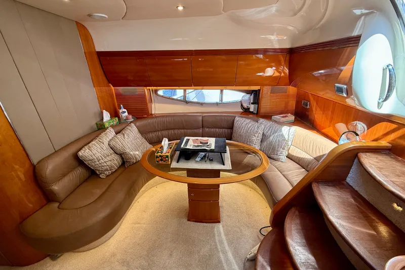 Slide: The Image of Luxurious interior of 2006 Azimut Atlantis 47 yacht with plush seating and elegant wood finishes. - 21