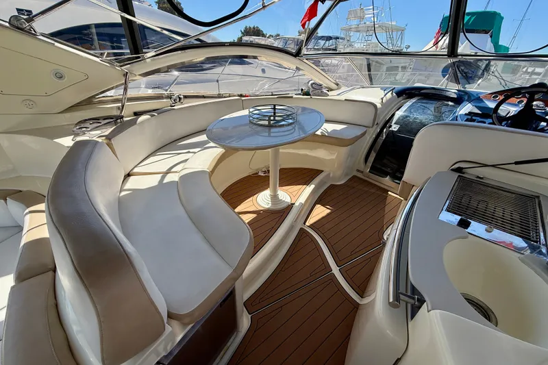 Slide: The Image of Luxurious 2006 Azimut Atlantis 47 yacht interior with elegant seating and wooden flooring. - 11
