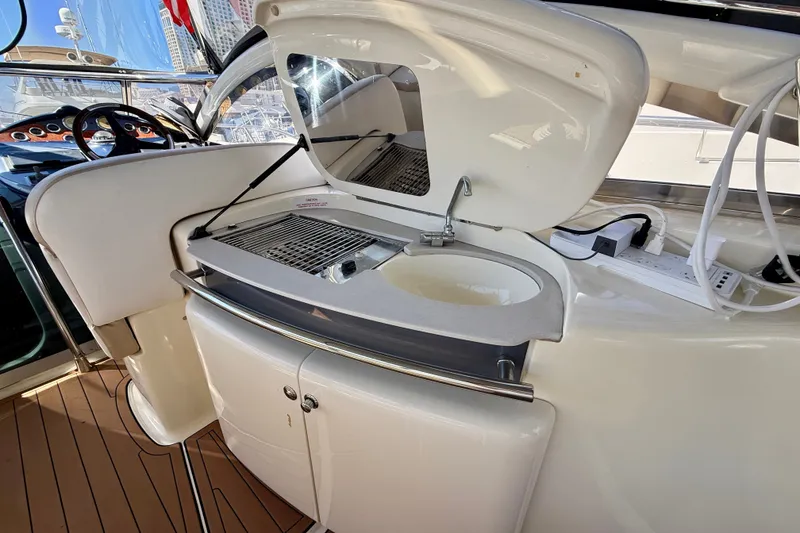 Slide: The Image of Outdoor kitchenette on 2006 Azimut Atlantis 47 yacht with sink and grill. - 12