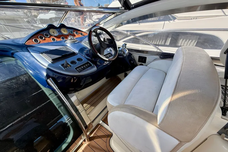 Slide: The Image of Cockpit of 2006 Azimut Atlantis 47 yacht with luxurious seating and modern controls. - 15