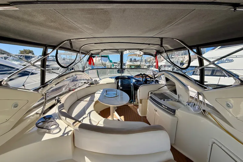 Slide: The Image of Luxurious 2006 Azimut Atlantis 47 yacht interior with elegant seating and modern helm. - 10
