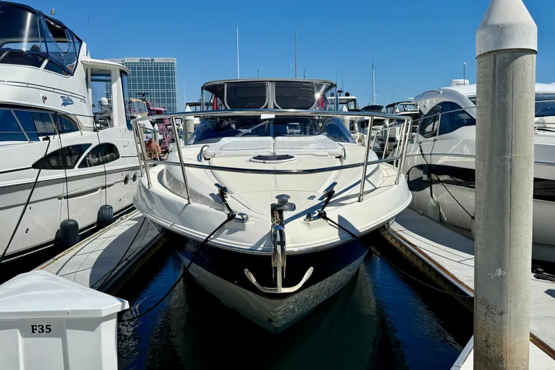Slide: The Image of 2006 Azimut Atlantis 47 yacht docked at marina, surrounded by other boats. - 1