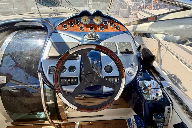 Slide: The Image of Cockpit of 2006 Azimut Atlantis 47 yacht with steering wheel and control panel. - 16