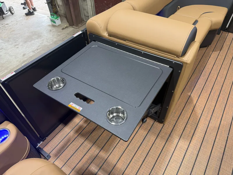Slide: The Image of A table with cup holders on a Bentley Pontoons Legacy 220 Swingback boat. - 27