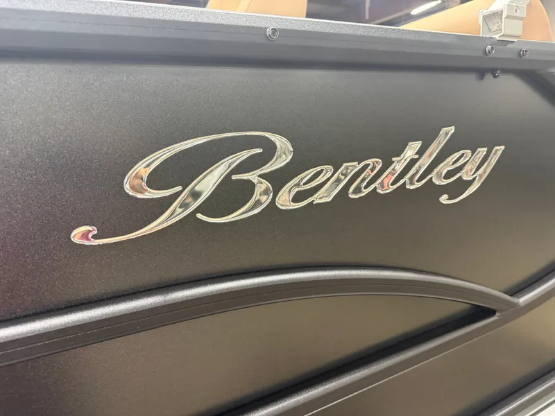 Slide: The Image of Close-up of the Bentley logo on a pontoon boat. - 38
