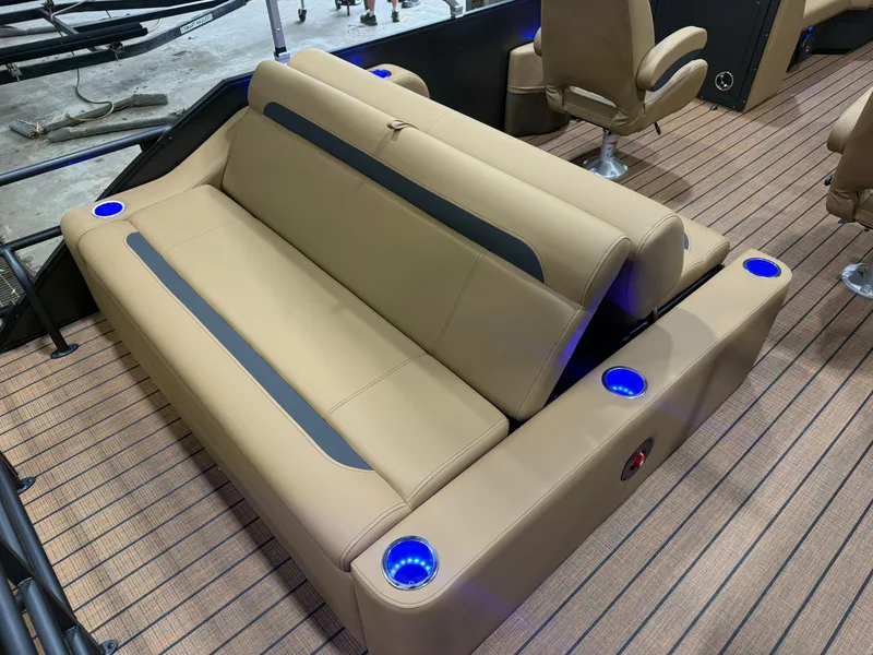 Slide: The Image of Luxurious seating area with blue LED cup holders on a Bentley pontoon boat. - 17