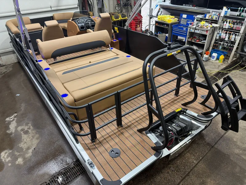 Slide: The Image of A Bentley Pontoons Legacy 220 Swingback with Honda 4-Stroke EFI. Spacious deck with beige seating. - 47