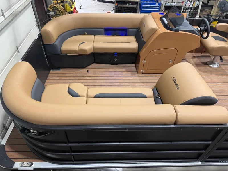 Slide: The Image of Luxurious pontoon boat with beige leather seating and modern helm, perfect for leisure cruising. - 3