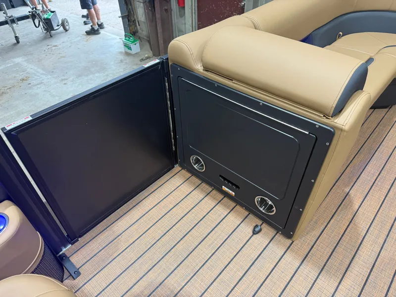 Slide: The Image of The image shows the interior of a Bentley Pontoons Legacy 220 Swingback with beige upholstery. - 26