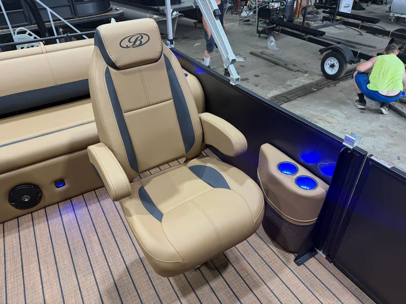 Slide: The Image of A luxurious swivel captain's chair in a Bentley pontoon boat with blue LED lighting. - 9