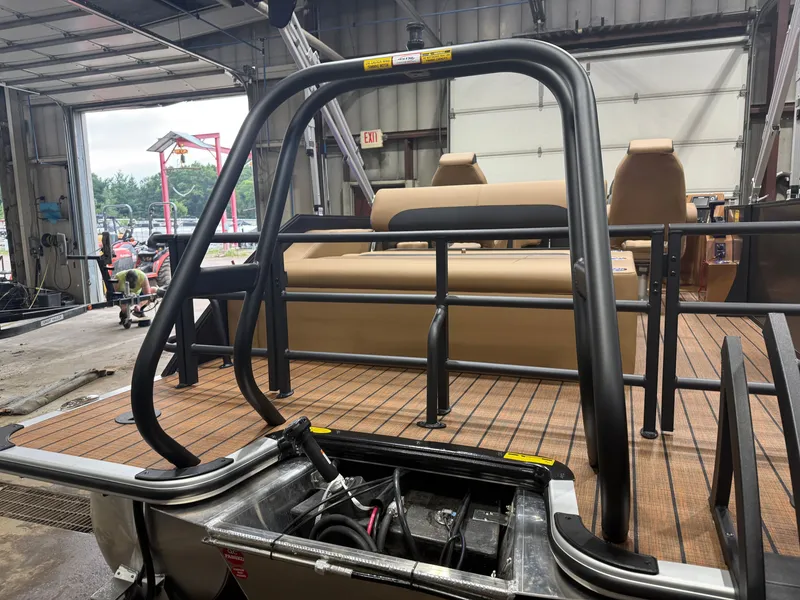 Slide: The Image of The image shows the deck of a Bentley Pontoons Legacy 220 Swingback with a Honda 4-Stroke EFI engine. - 43