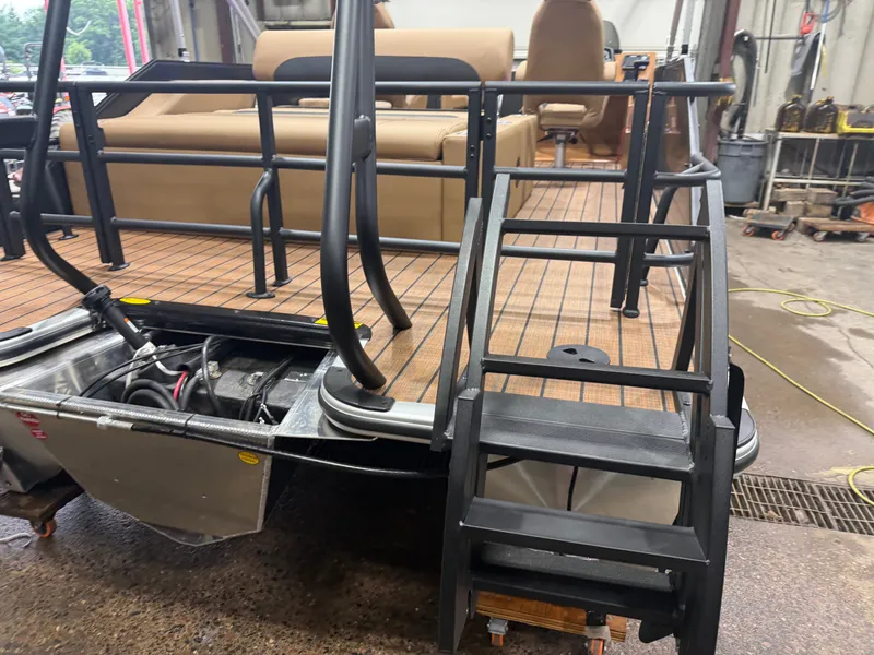 Slide: The Image of A Bentley Pontoons Legacy 220 Swingback with Honda 4-Stroke EFI. It shows the deck and stairs. - 44