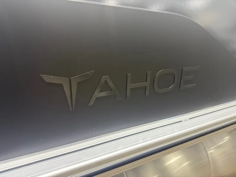 Slide: The Image of Close-up of the Tahoe logo on a boat. - 33