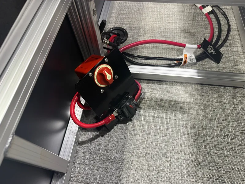 Slide: The Image of An electrical panel with red and black cables in a metal frame. - 20