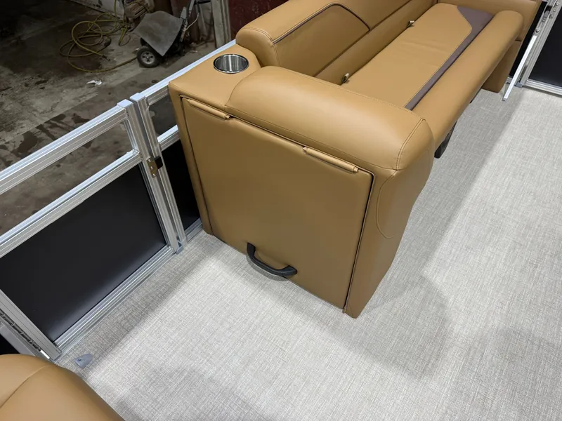 Slide: The Image of The image shows a brown leather bench seat on a boat with a cup holder. - 23