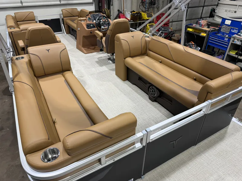 Slide: The Image of Interior of a modern pontoon boat with brown leather seating and a helm station. - 21