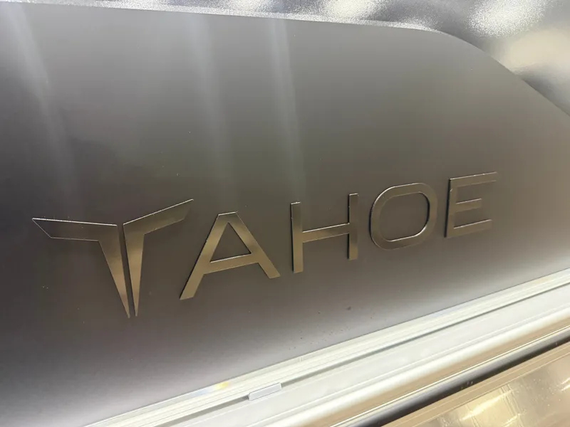 Slide: The Image of Close-up of the Tahoe logo on a boat, featuring a glossy surface. - 33
