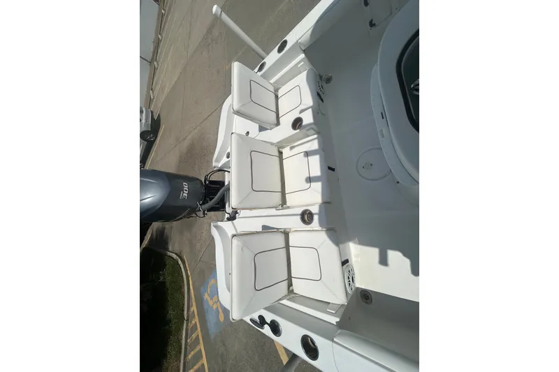 Slide: The Image of 2018 Sea Hunt BX25FS boat interior with seating and Yamaha 300 engine. - 28