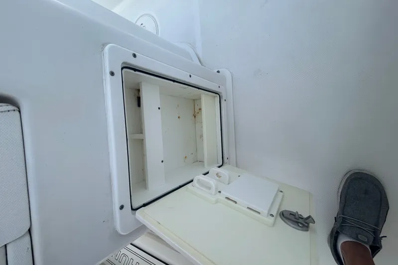 Slide: The Image of Open storage compartment on 2018 Sea Hunt BX25FS boat deck. - 18