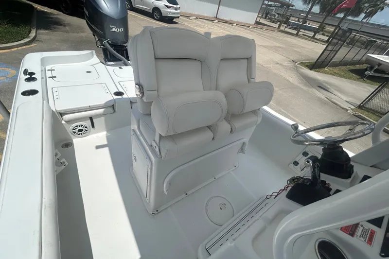 Slide: The Image of 2018 Sea Hunt BX25FS boat interior with dual seats and steering console. - 15