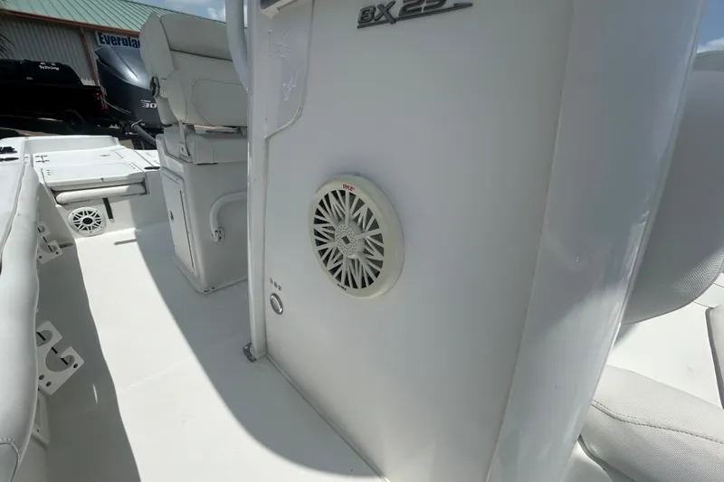 Slide: The Image of 2018 Sea Hunt BX25FS boat interior with speaker and seating. - 19