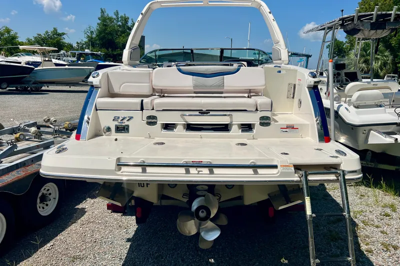 Slide: The Image of 2020 Chaparral 277 SSX boat rear view with swim platform and ladder. - 8