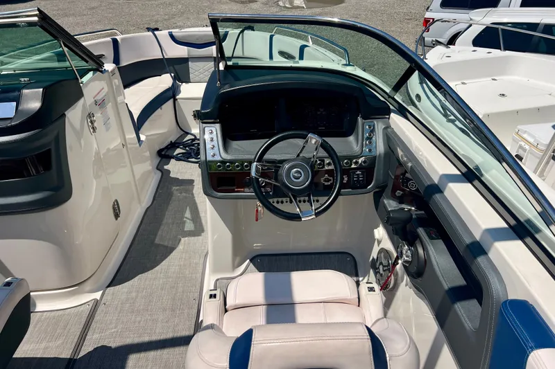 Slide: The Image of 2020 Chaparral 277 SSX boat cockpit with modern steering and seating. - 15