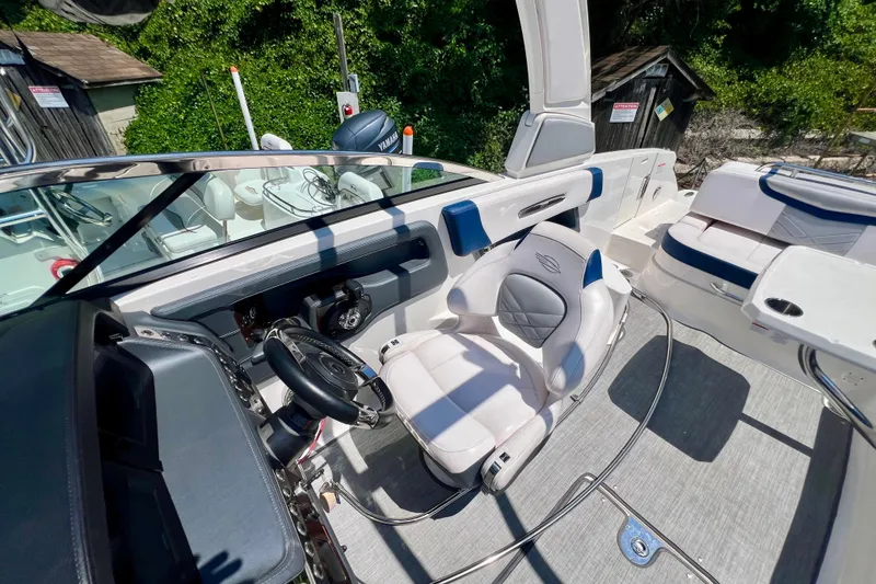 Slide: The Image of 2020 Chaparral 277 SSX boat interior with luxurious seating and modern dashboard. - 21