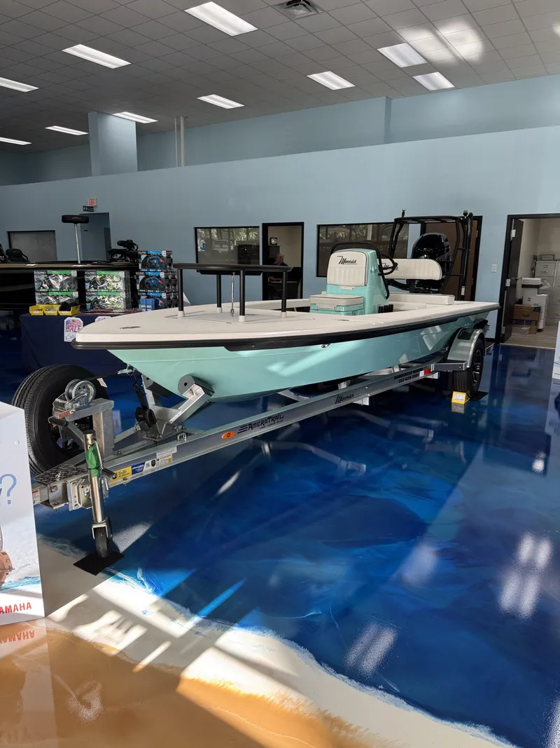 Slide: The Image of A 2027 Maverick 18 HPX-V boat on a trailer in a showroom setting. - 14