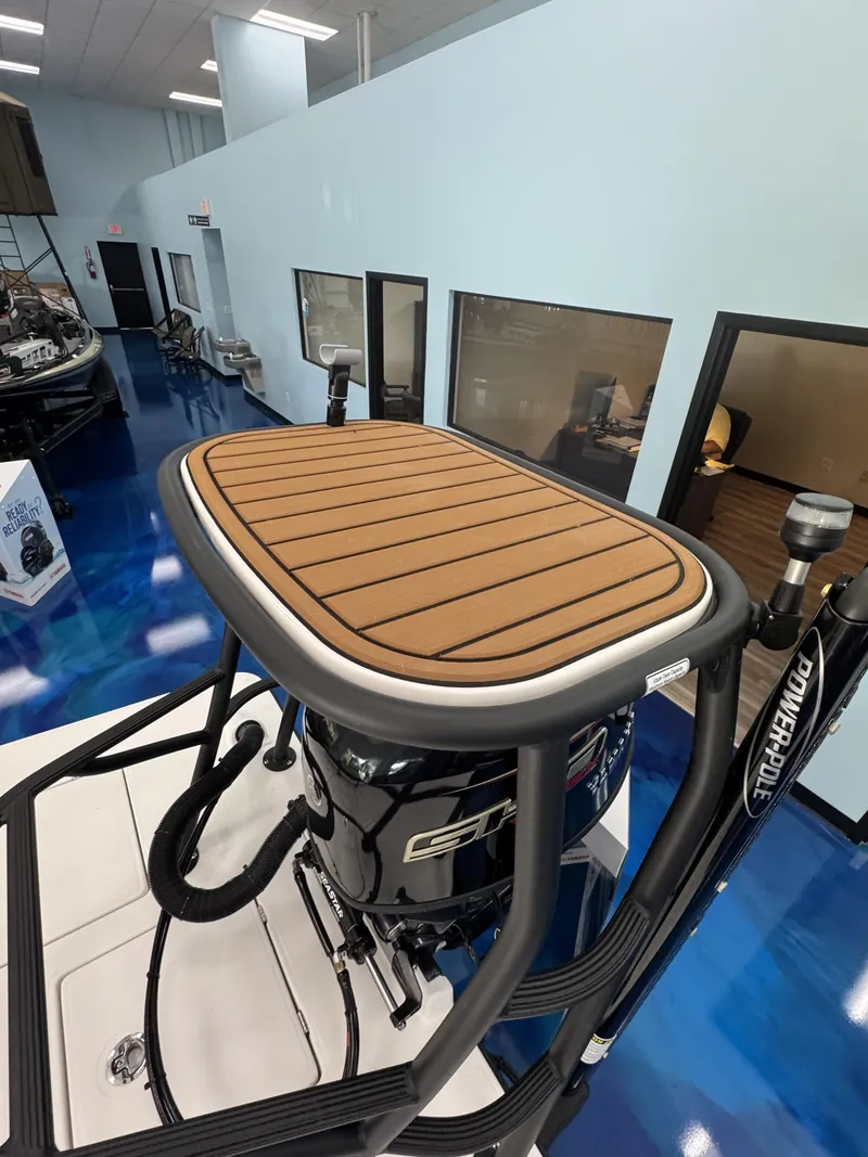 Slide: The Image of The image shows the elevated helm platform of a 2027 Maverick 18 HPX-V with a cushioned deck. - 34