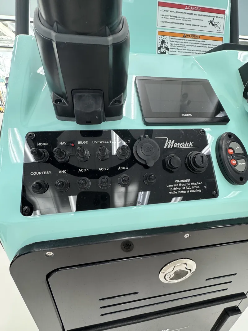 Slide: The Image of The image shows the console of a Maverick 18 HPX-V boat with various switches and displays. - 15