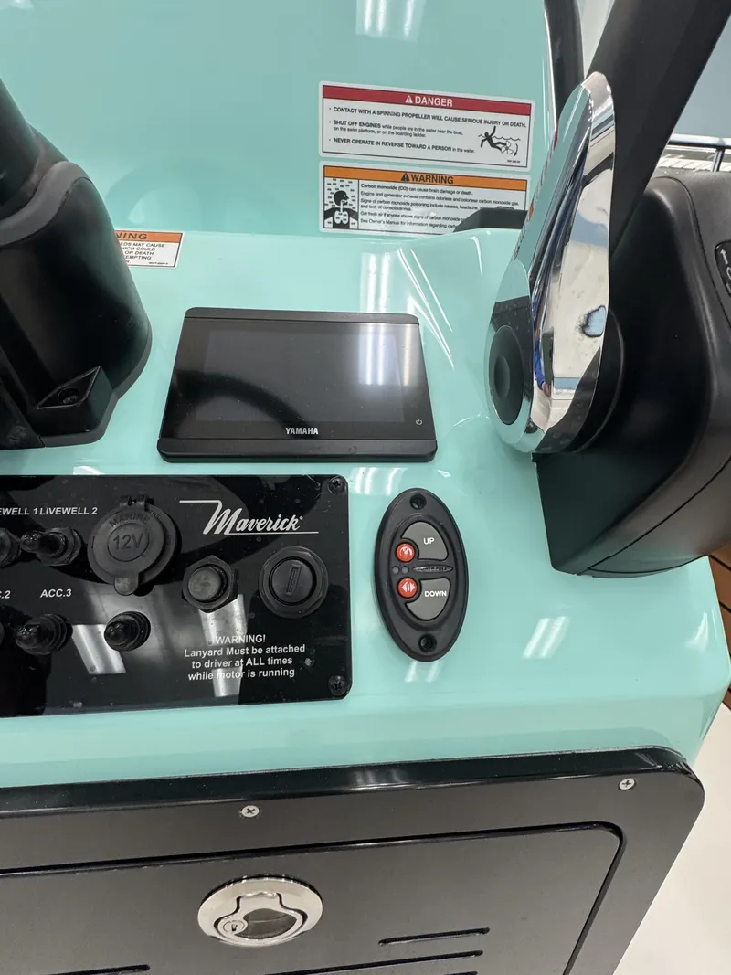 Slide: The Image of The image shows the console of a Maverick 18 HPX-V boat with various controls. - 26