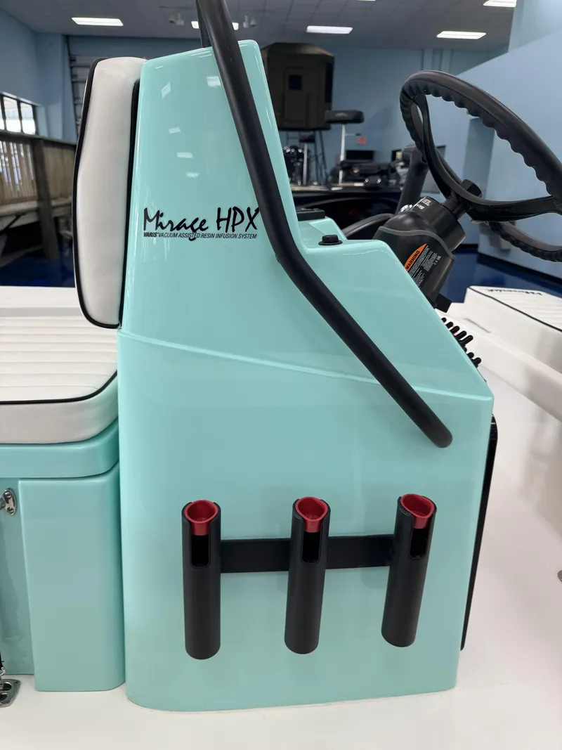 Slide: The Image of The image shows the helm console of a Maverick 18 HPX-V boat in light blue. - 18