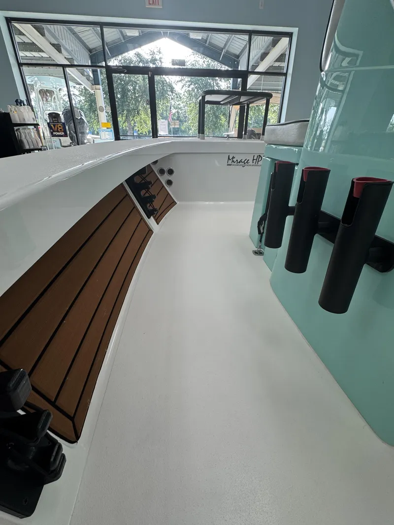 Slide: The Image of Interior view of a 2027 Maverick 18 HPX-V boat with rod holders and wood accents. - 25