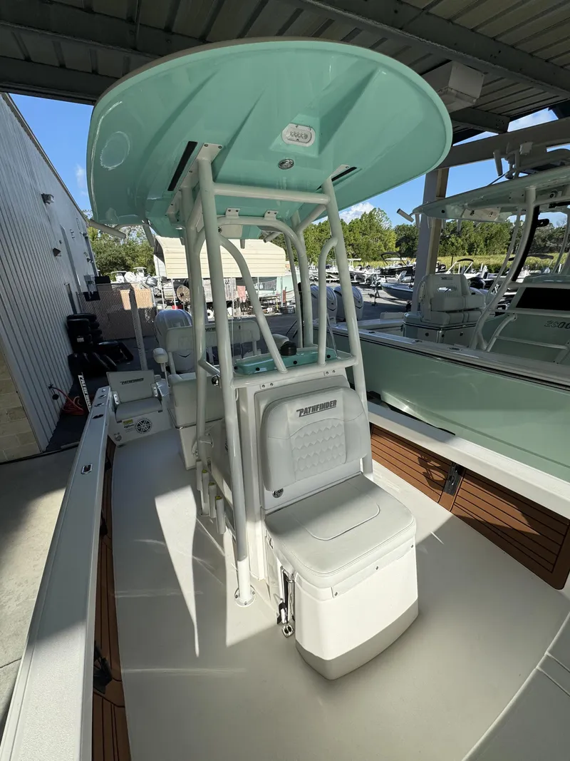 Slide: The Image of A modern 2027 Pathfinder 2500 Tournament with a turquoise T-top and comfortable seating. - 24