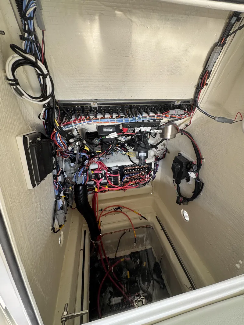 Slide: The Image of Electrical and engine components in a boat's engine compartment. - 28