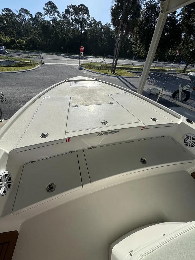 Slide: The Image of The image shows the deck of a 2027 Pathfinder 2500 Tournament boat, parked in a lot. - 16