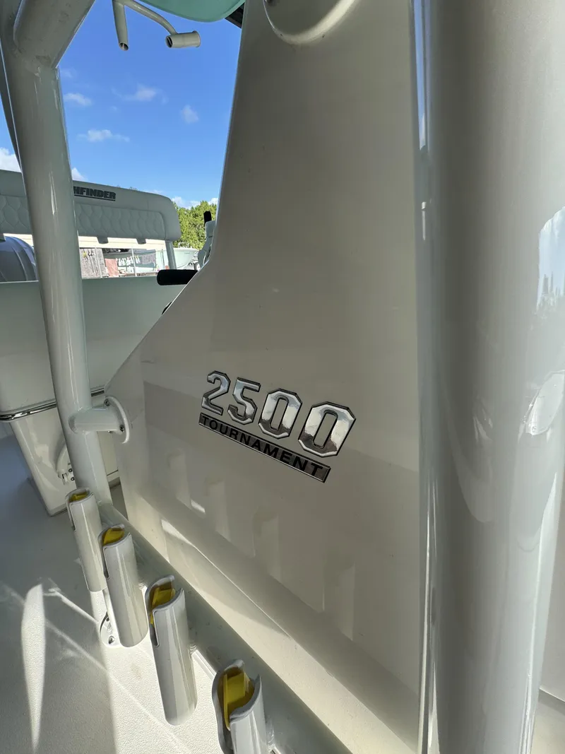 Slide: The Image of Close-up of the Pathfinder 2500 Tournament boat with fishing rod holders and blue sky in the background. - 30