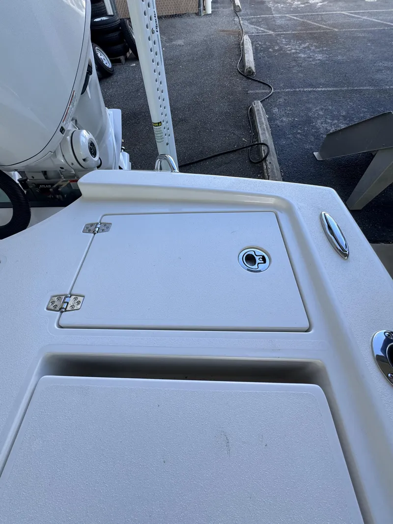 Slide: The Image of The image shows the deck of a Pathfinder 2500 Tournament boat with storage hatches. - 47