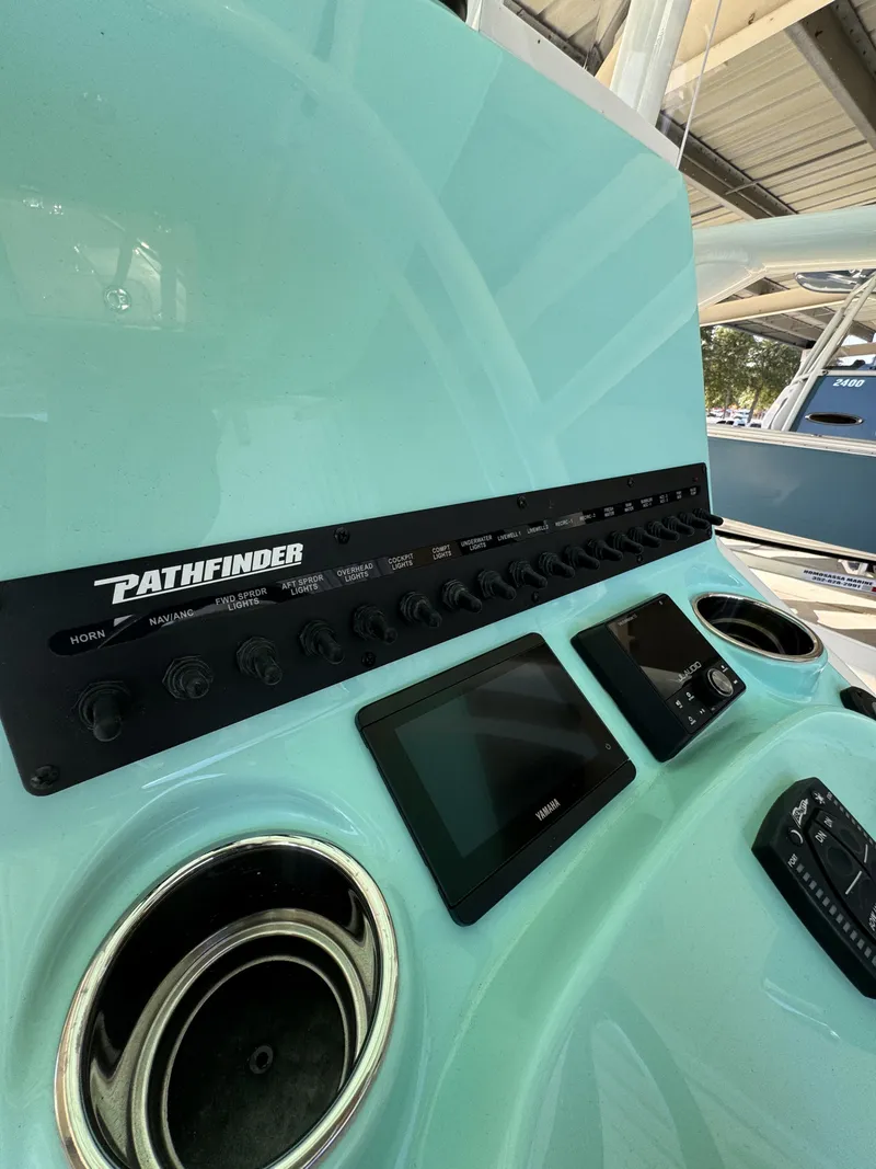 Slide: The Image of The image shows the dashboard of a 2027 Pathfinder 2500 Tournament boat with modern controls. - 38