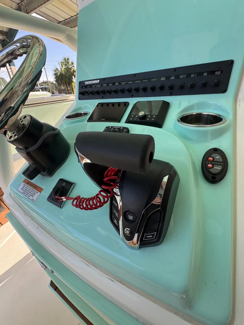 Slide: The Image of The image shows the helm of a 2027 Pathfinder 2500 Tournament boat with modern controls. - 41