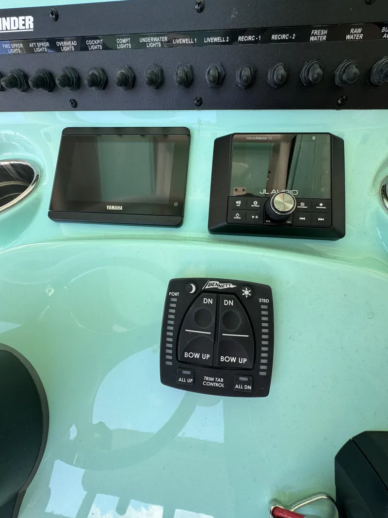 Slide: The Image of The image shows the dashboard of a Pathfinder 2500 Tournament boat with various controls and displays. - 36