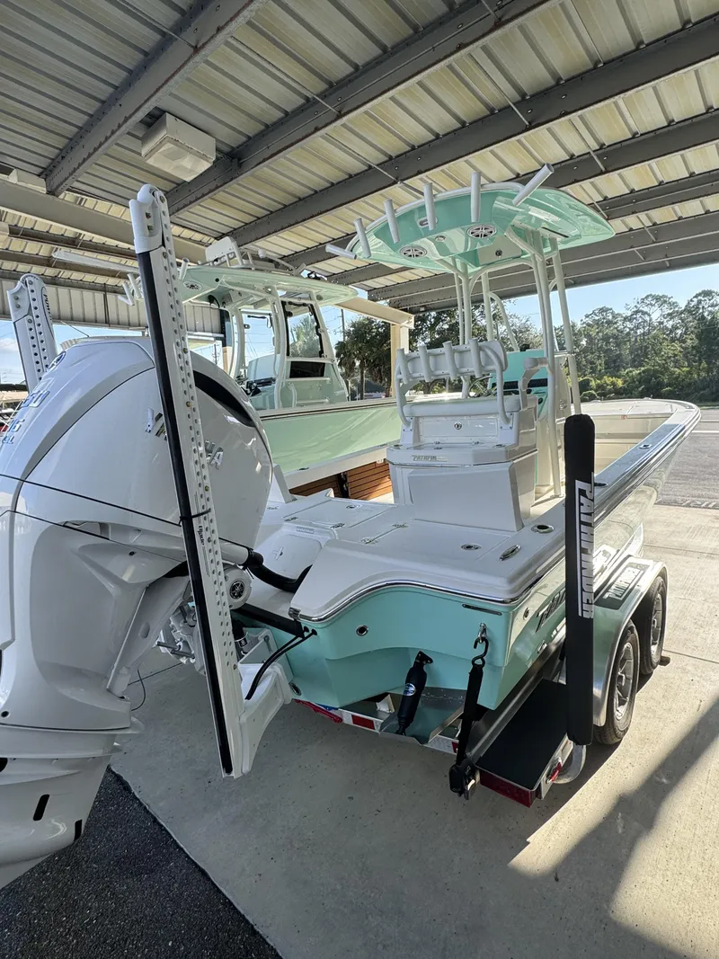 Slide: The Image of A modern 2027 Pathfinder 2500 Tournament sits on a trailer under a covered area. - 15