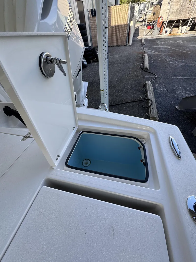 Slide: The Image of An open storage compartment on a 2027 Pathfinder 2500 Tournament boat. - 49