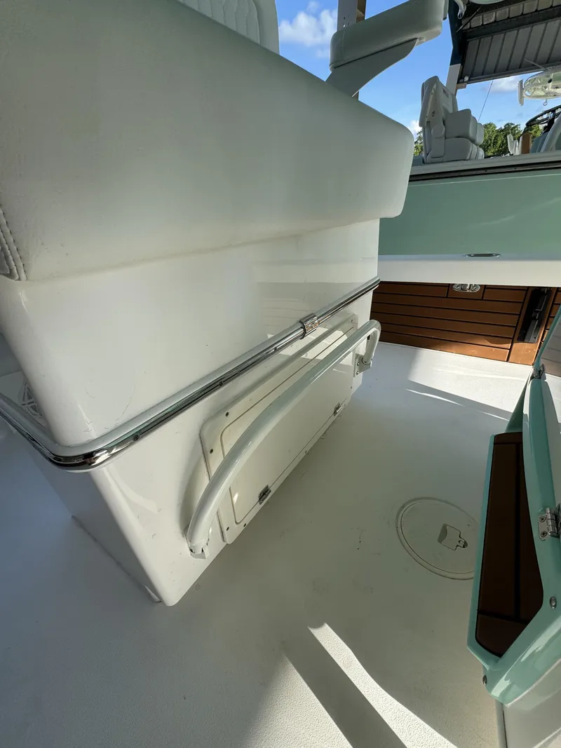 Slide: The Image of Close-up of the white seating area on a Pathfinder 2500 Tournament boat, featuring stainless steel railing. - 33