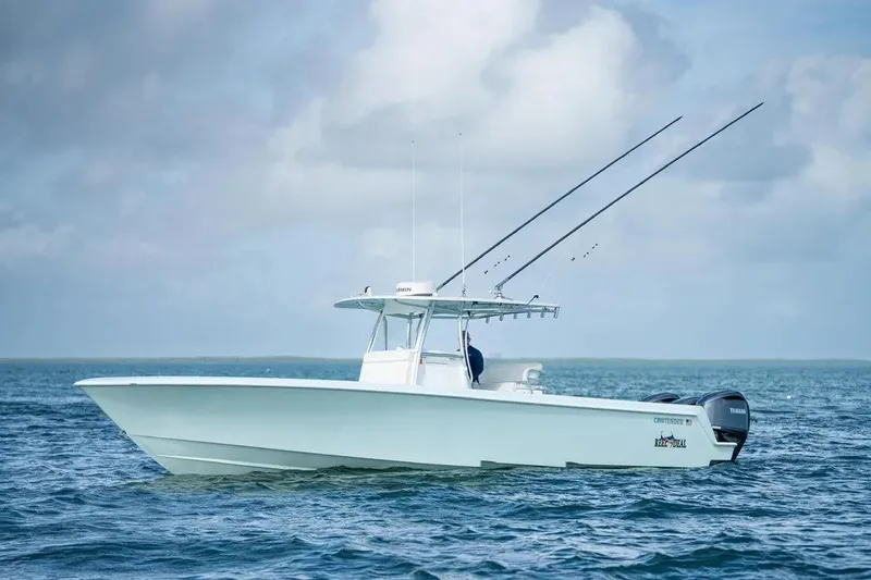 The Image of 2025 Contender 39 ST boat on open water under cloudy sky. - 1