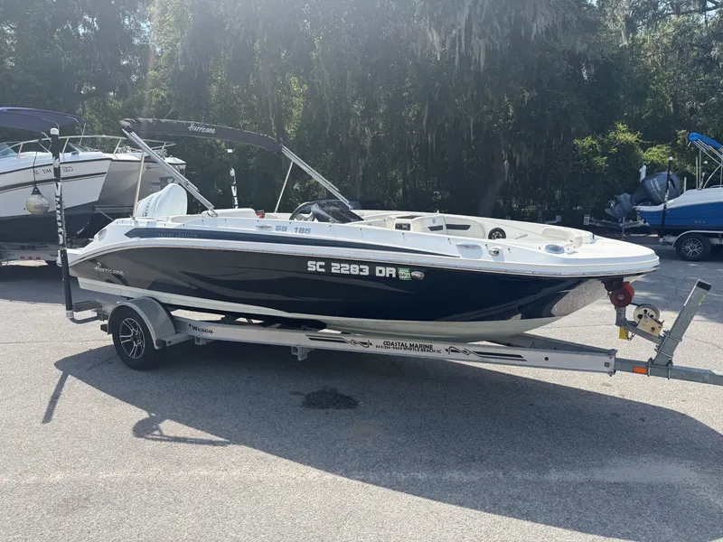 The Image of A 2021 Hurricane SS 185 boat is on a trailer in a sunny outdoor setting. - 1